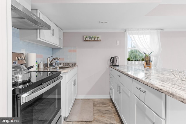 kitchen featuring stainless steel electric stove, white cabinets, light stone countertops, and wall chimney exhaust hood