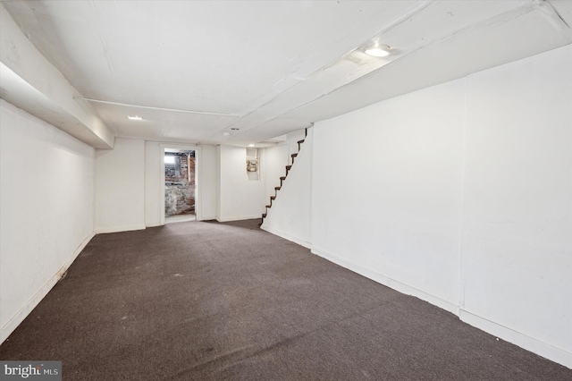 basement with dark carpet