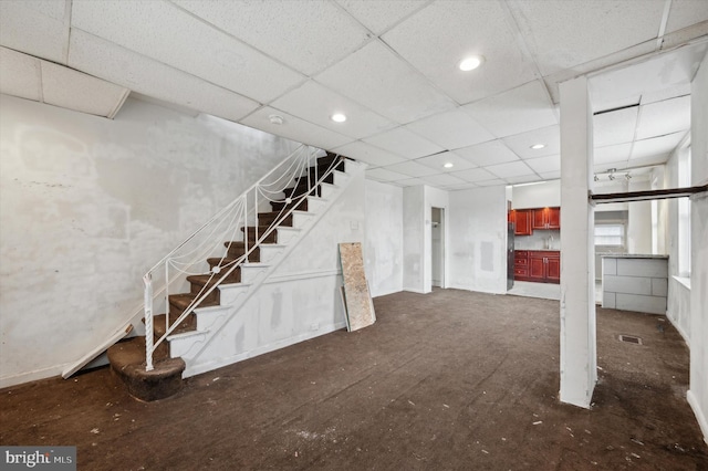 basement featuring a drop ceiling