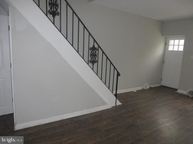 entrance foyer with dark hardwood / wood-style flooring