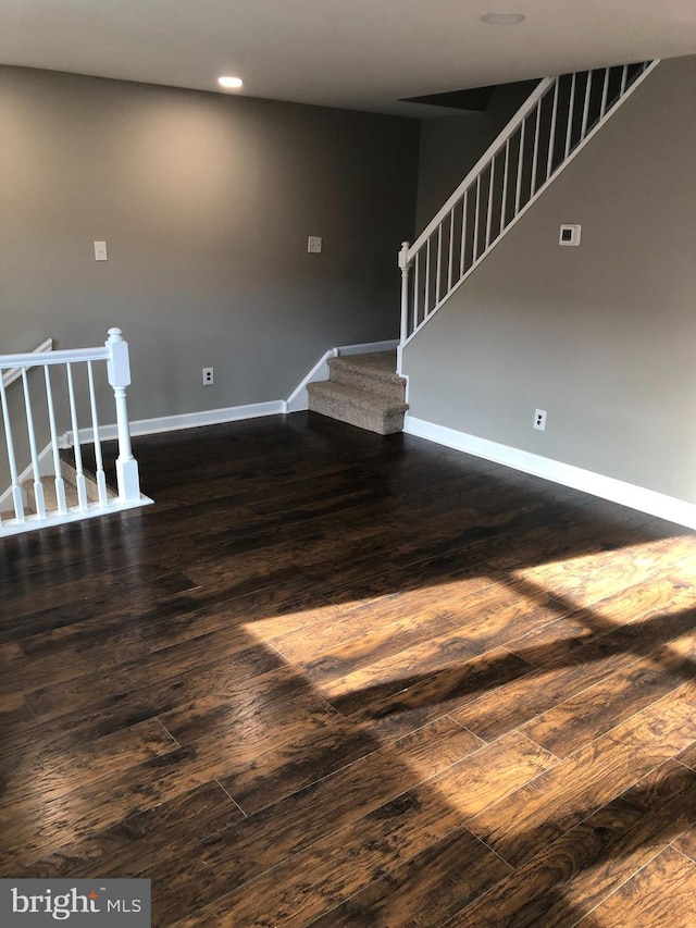 spare room featuring dark hardwood / wood-style floors