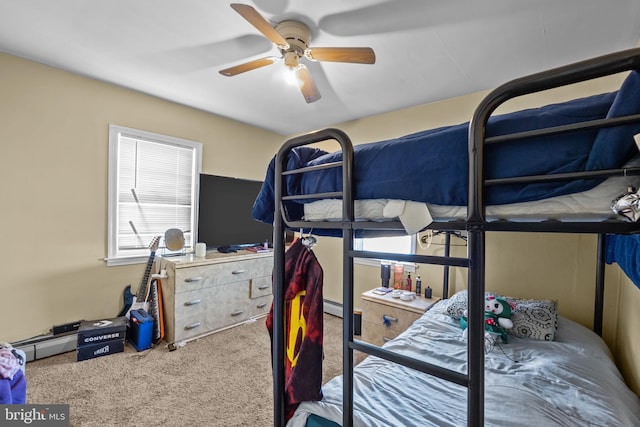 bedroom with ceiling fan, a baseboard radiator, and carpet flooring