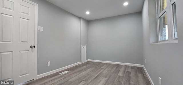 unfurnished room with light hardwood / wood-style floors