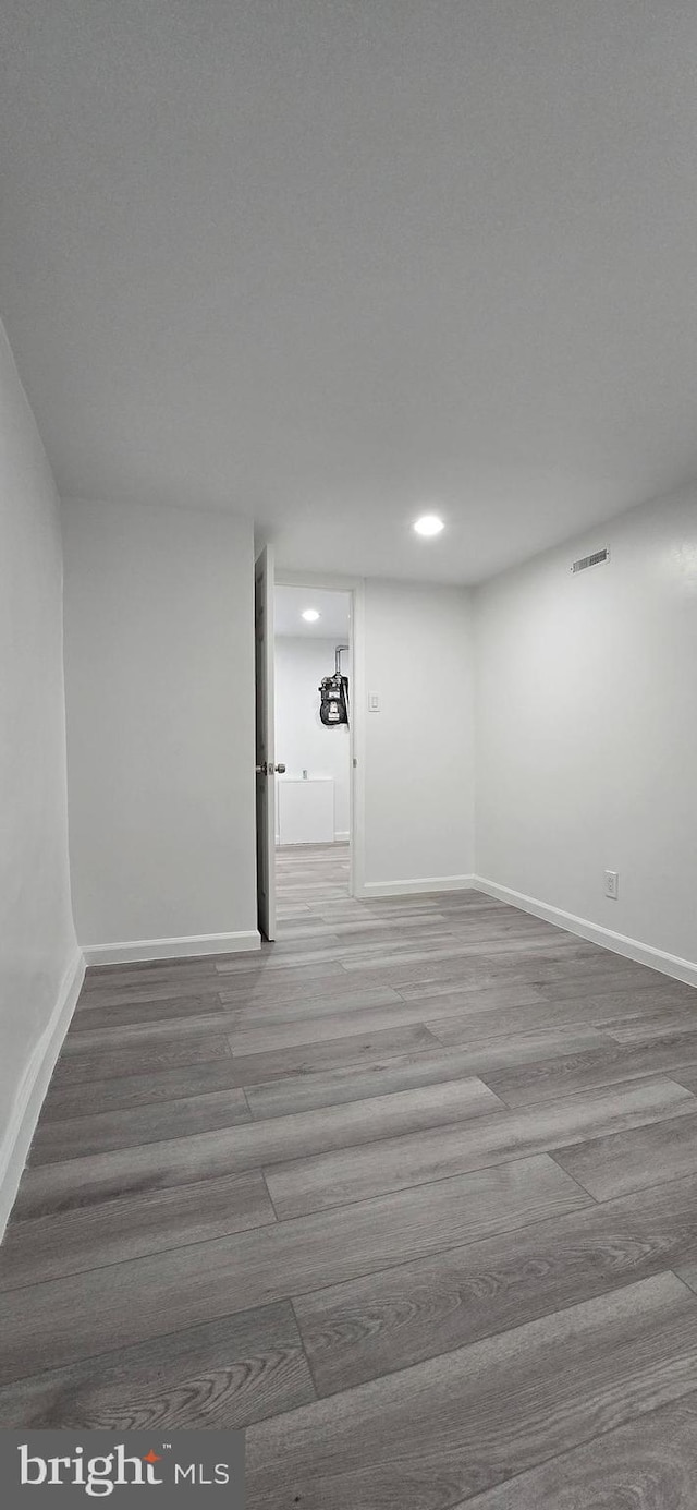 empty room featuring hardwood / wood-style flooring