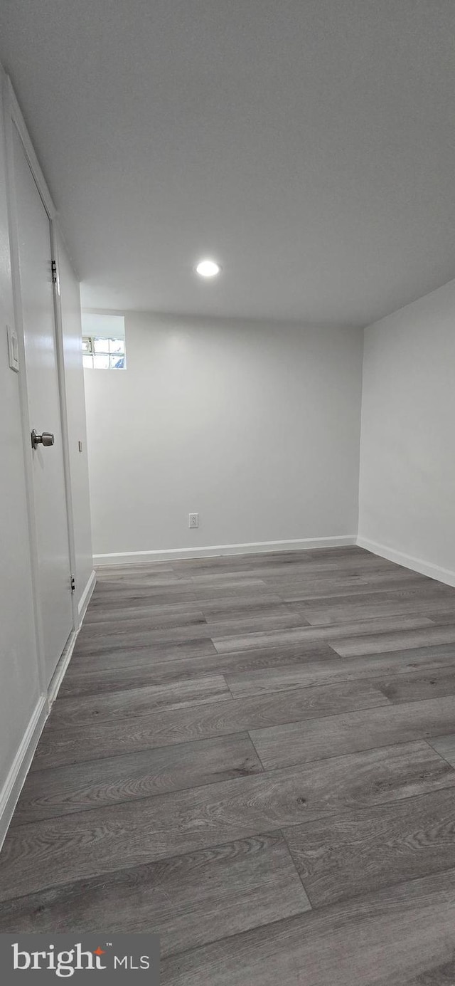 basement featuring dark wood-type flooring