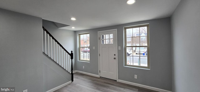 foyer entrance featuring plenty of natural light and light hardwood / wood-style floors