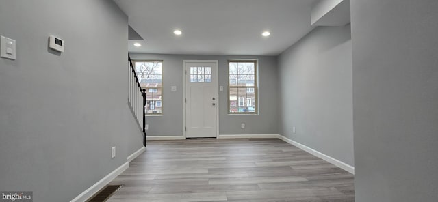 entrance foyer with light hardwood / wood-style flooring