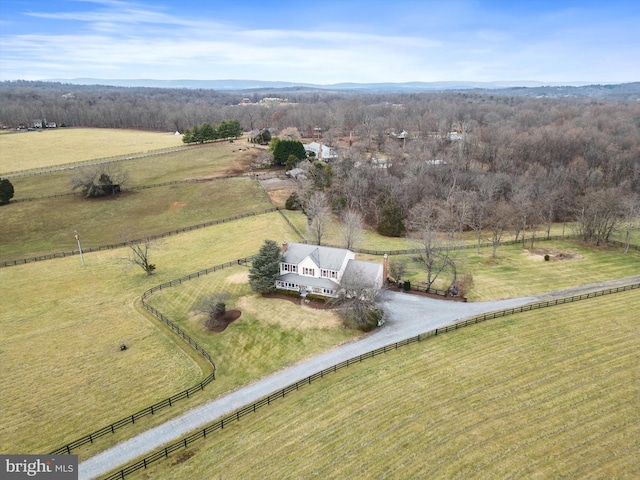 birds eye view of property with a rural view