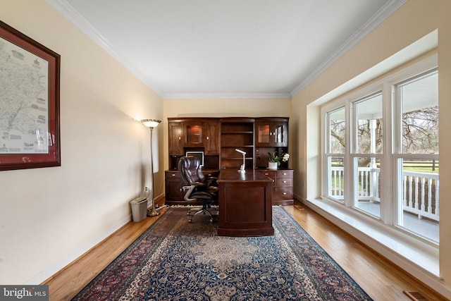 office area with dark hardwood / wood-style flooring and crown molding