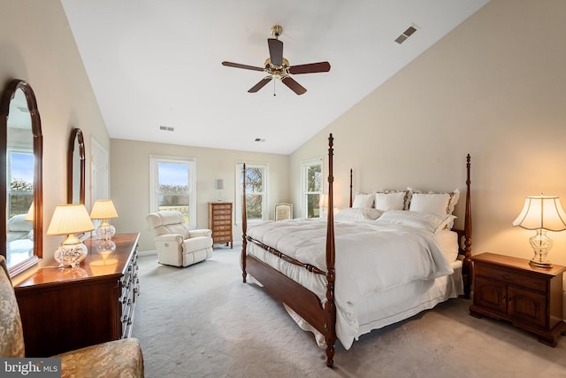 bedroom with vaulted ceiling, ceiling fan, and light carpet