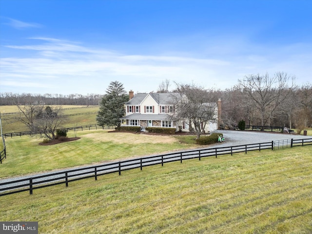 view of yard with a rural view