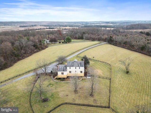 birds eye view of property with a rural view