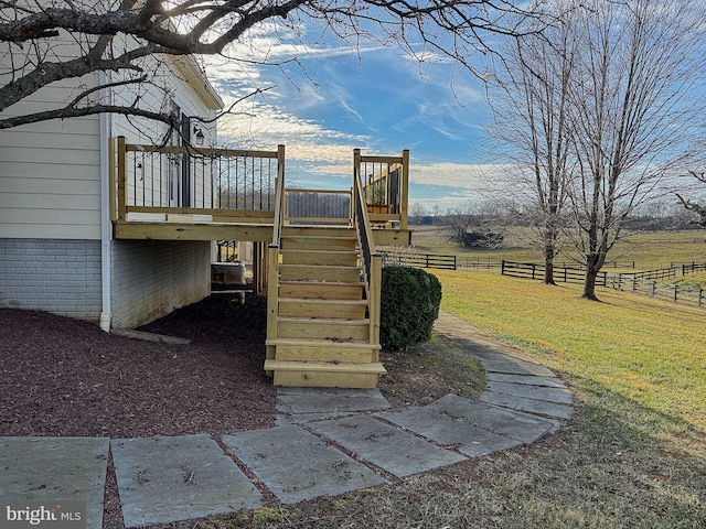 exterior space featuring a rural view and a deck