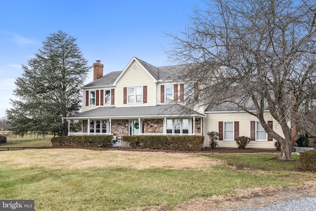 view of front of property with a front lawn and a porch