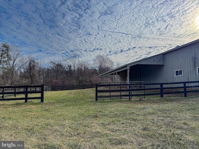 exterior space with a rural view and an outdoor structure