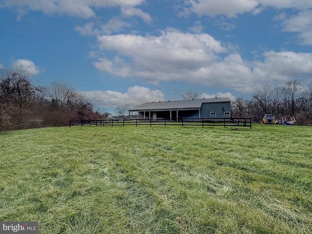 view of yard with a rural view