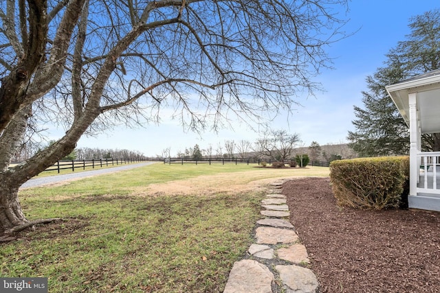 view of yard with a rural view