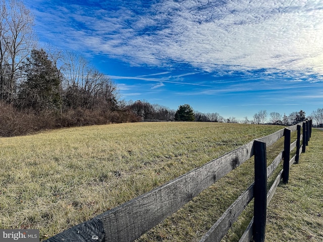 view of yard with a rural view