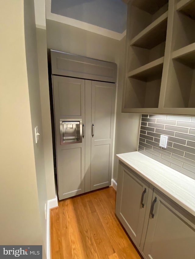 1750 S St NW Unit 1, Washington, DC 20009 - kitchen featuring light wood-style floors, decorative backsplash, open shelves, and light countertops