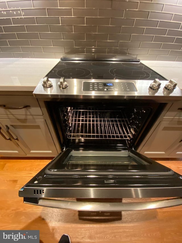1750 S St NW Unit 1, Washington, DC 20009 - kitchen view of stainless steel electric range oven and light countertops