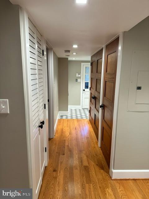 1750 S St NW Unit 1, Washington, DC 20009 - hall with light wood-type flooring and electric panel