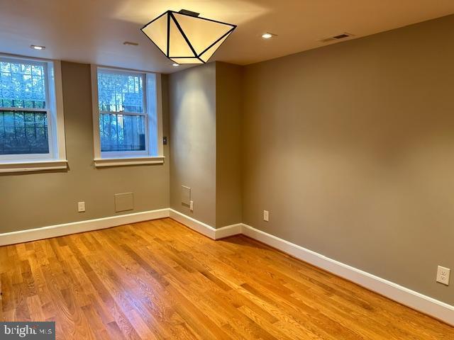 spare room with light hardwood / wood-style flooring