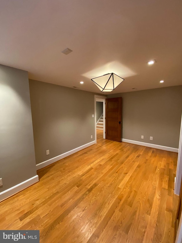 spare room featuring light hardwood / wood-style floors