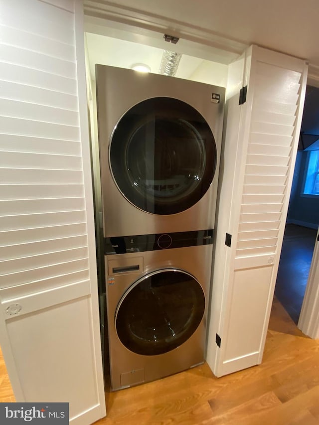 1750 S St NW Unit 1, Washington, DC 20009 - laundry area featuring estacked washer and dryer and light wood-style flooring