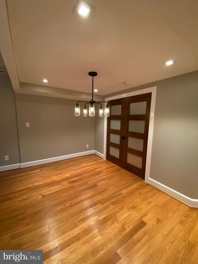 unfurnished dining area with light hardwood / wood-style flooring and french doors