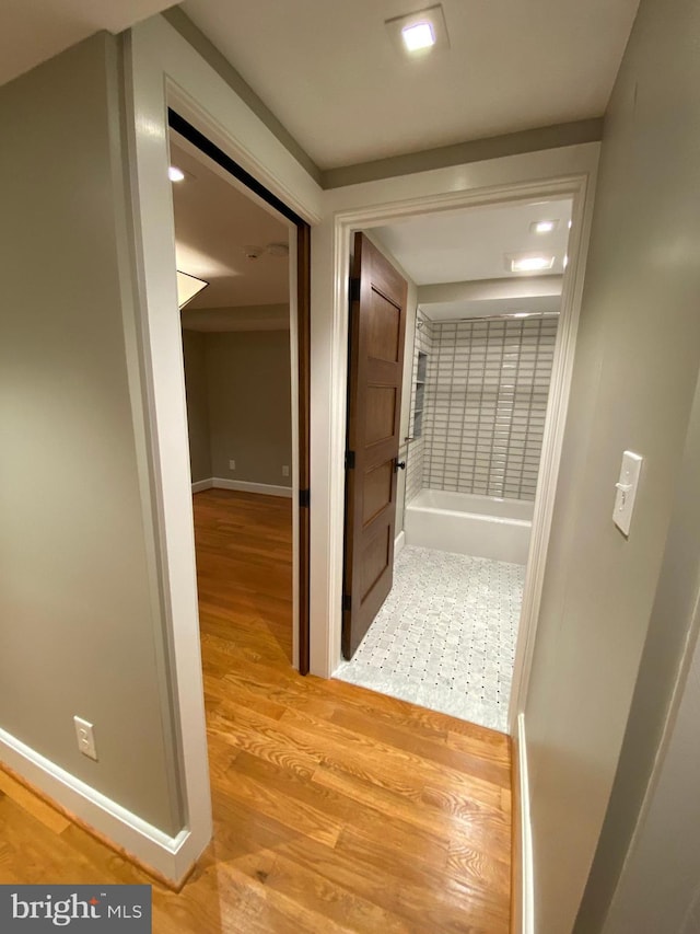 hall with light wood-type flooring