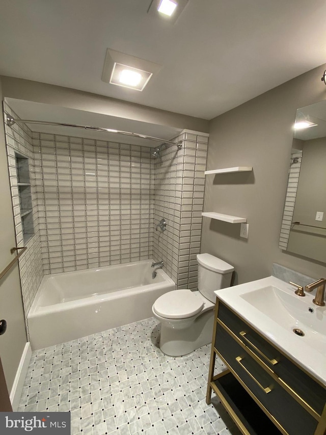 full bathroom with vanity, toilet, and tiled shower / bath