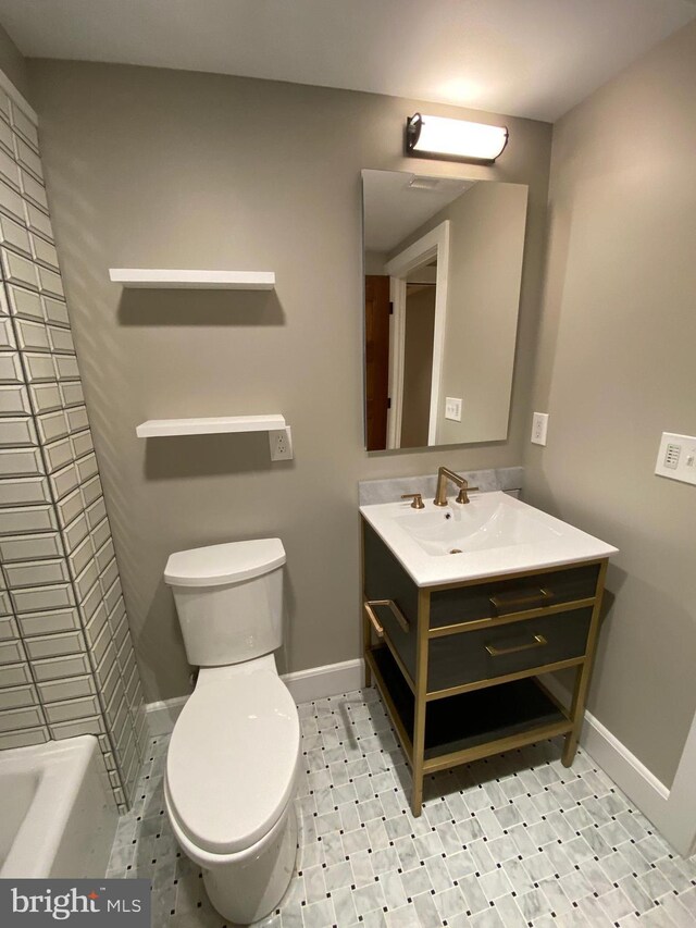 bathroom featuring a bath, vanity, and toilet