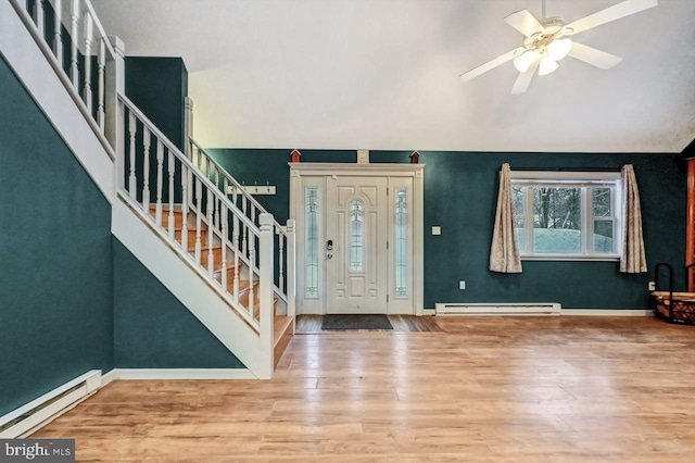 foyer with ceiling fan, wood-type flooring, and a baseboard radiator