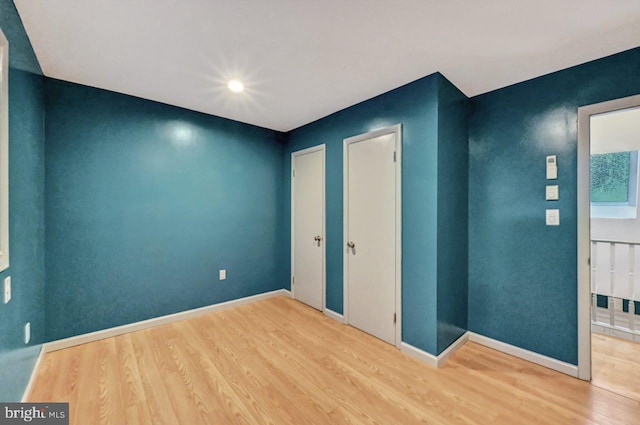 unfurnished bedroom featuring hardwood / wood-style floors