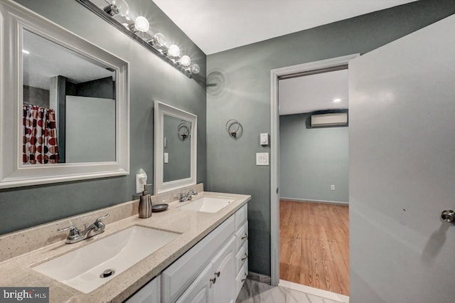 bathroom featuring vanity and wood-type flooring