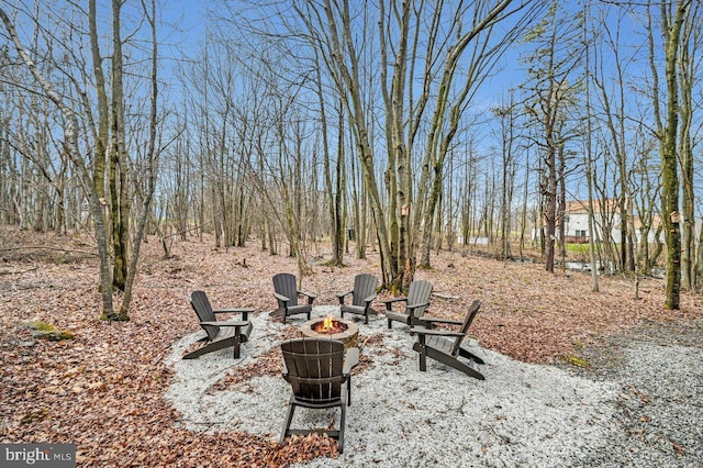 view of yard with a fire pit