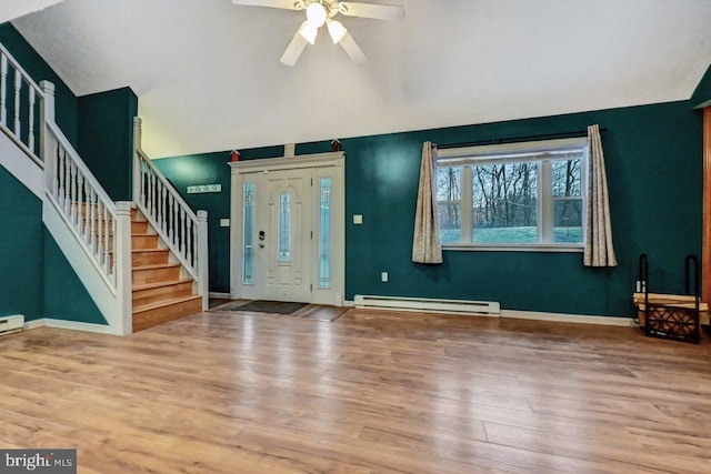 foyer featuring hardwood / wood-style flooring, ceiling fan, vaulted ceiling, and a baseboard radiator