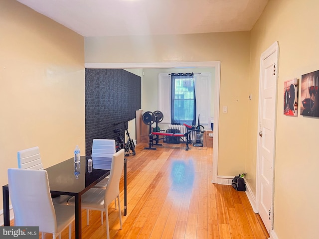 dining space with light hardwood / wood-style floors