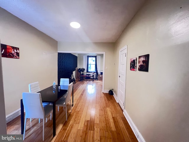 hallway with wood-type flooring