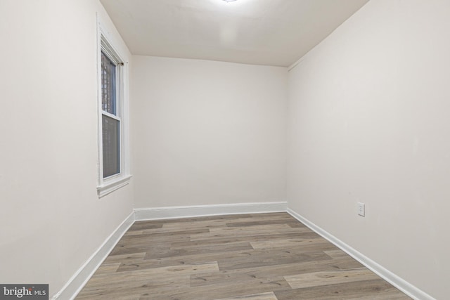 empty room featuring hardwood / wood-style flooring