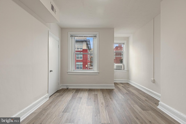 unfurnished room featuring light wood-type flooring