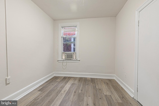 empty room featuring light hardwood / wood-style flooring and cooling unit