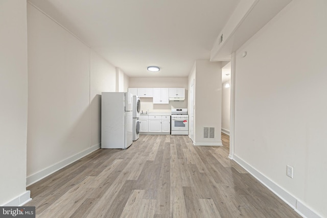 interior space with light hardwood / wood-style floors