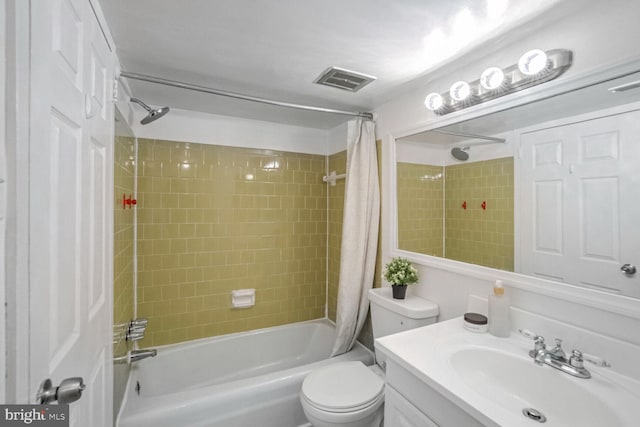 full bathroom with shower / tub combo, vanity, and toilet