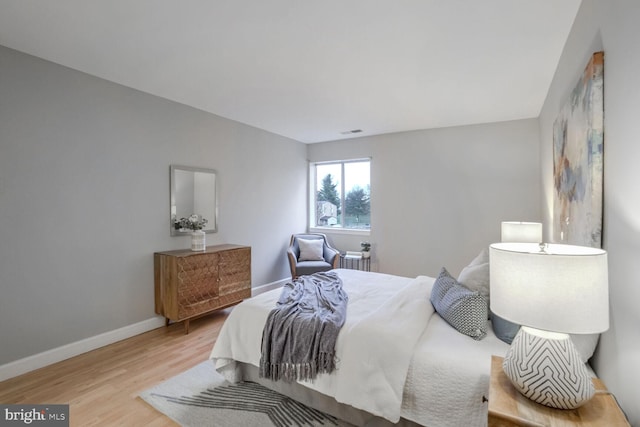 bedroom with light hardwood / wood-style flooring