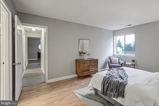 bedroom with light wood-type flooring