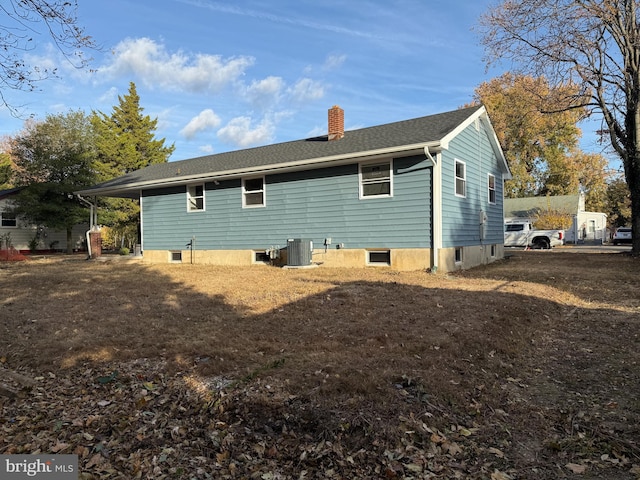 rear view of house with central air condition unit