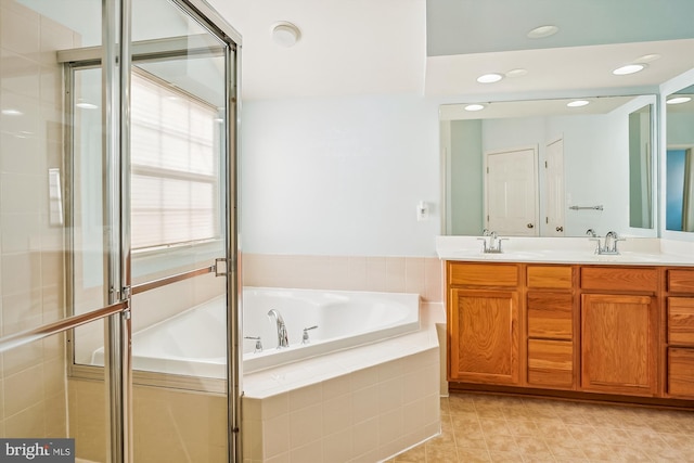 bathroom featuring vanity, tile patterned floors, and independent shower and bath