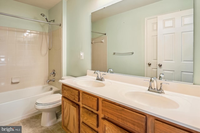 full bathroom featuring tile patterned floors, vanity, toilet, and tiled shower / bath