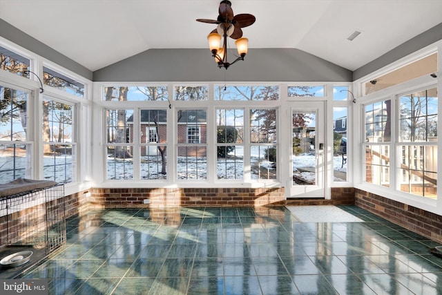 sunroom / solarium featuring lofted ceiling